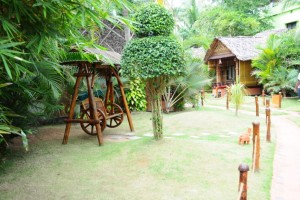 Wooden artefacts amidst greenery Wooden artefacts amidst greenery